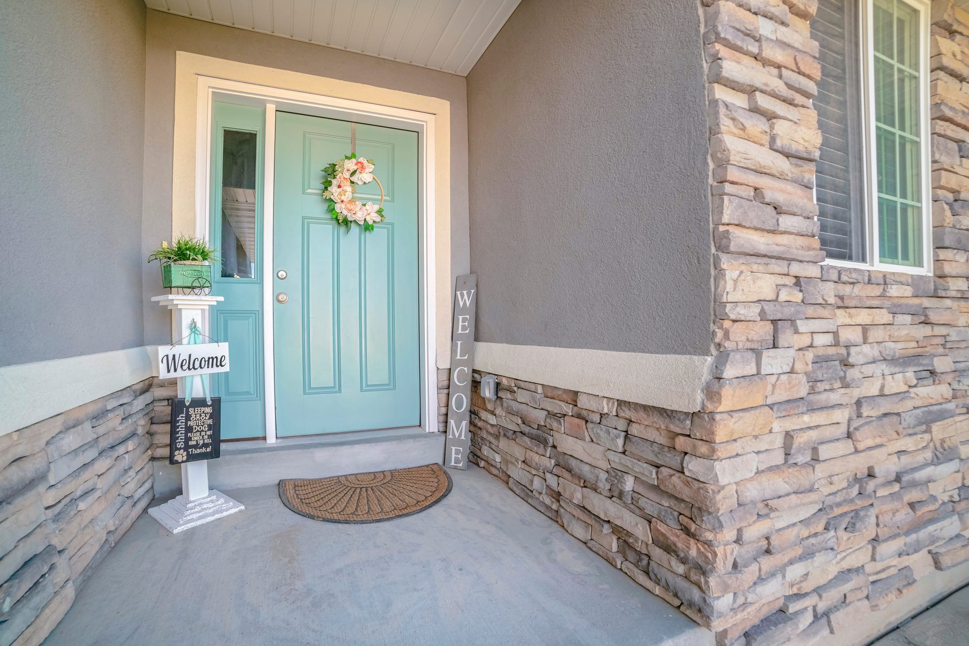 Teal Door With Sidelight On Neighborhood Home