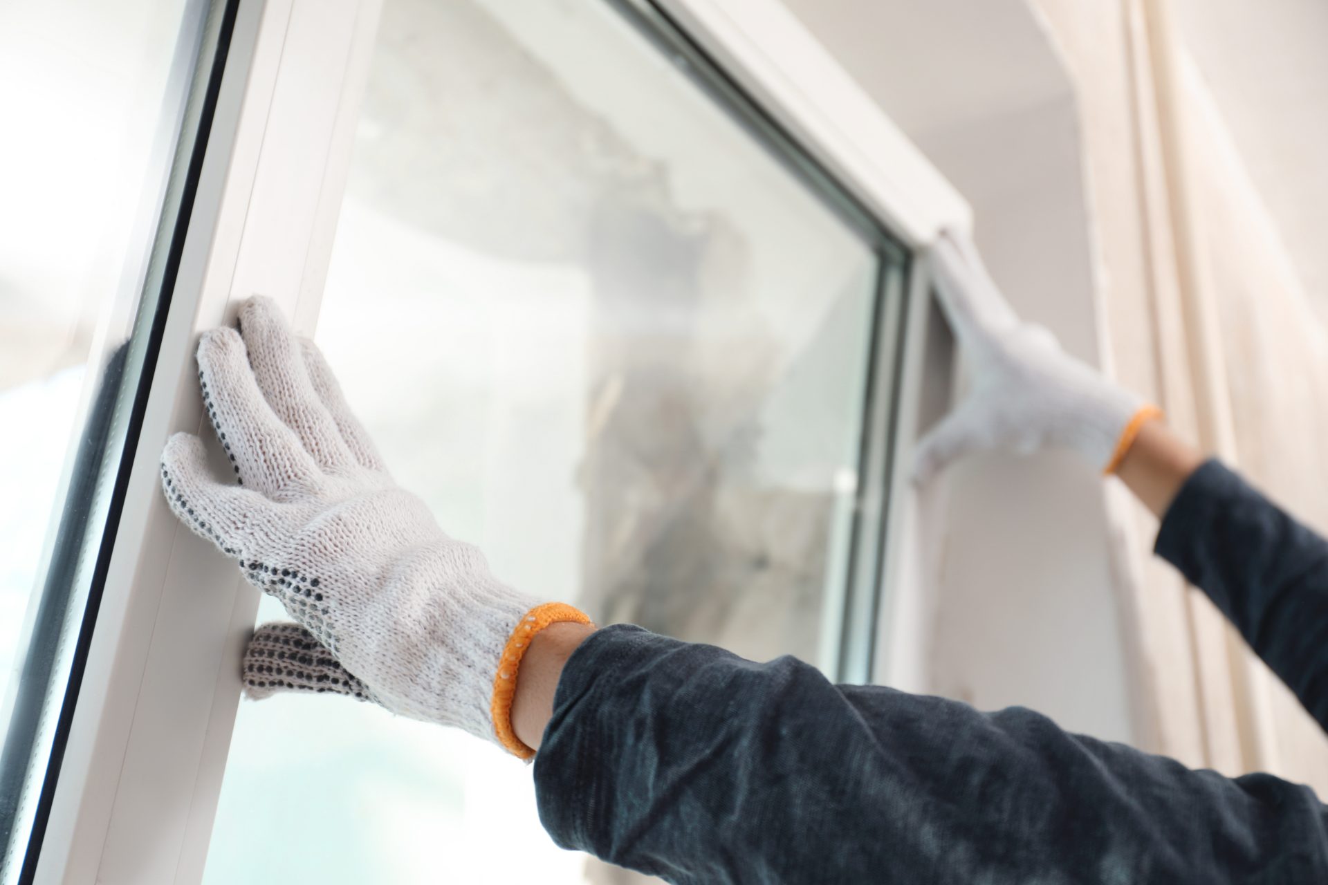 Worker installing replacement window