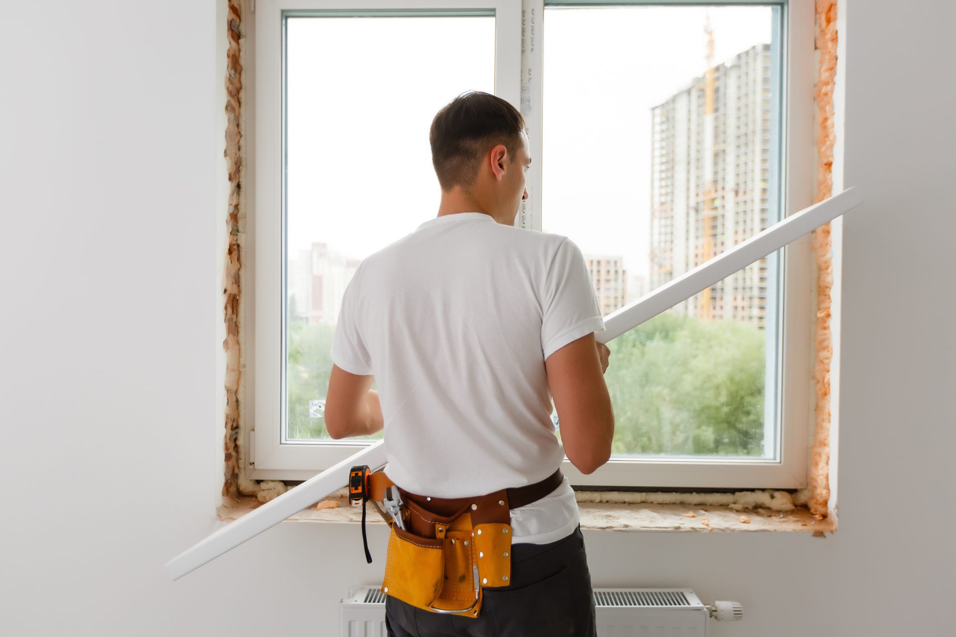 Professional Installer Working On Window