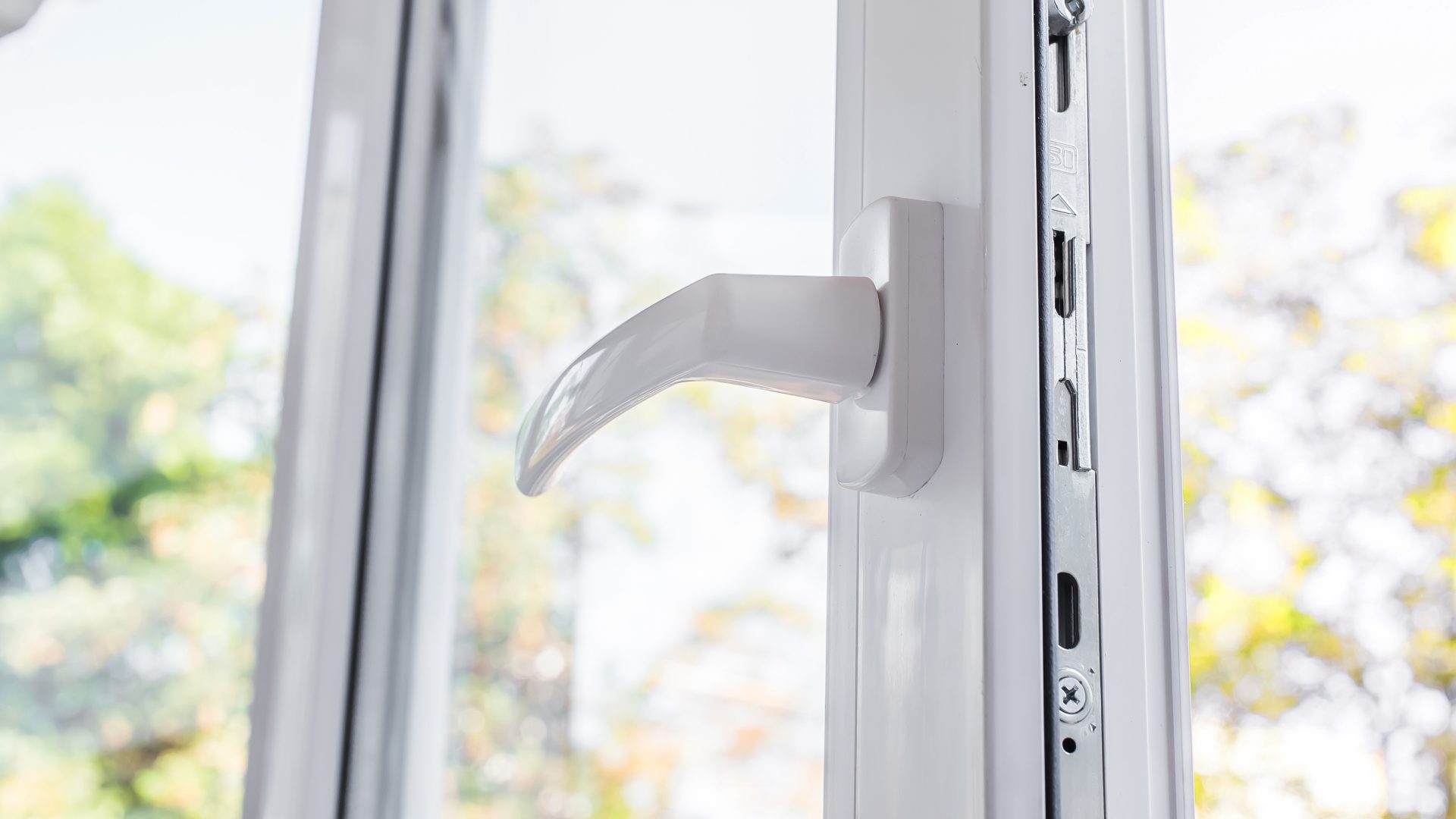 Close view of the handle mechanism on a partially open casement window