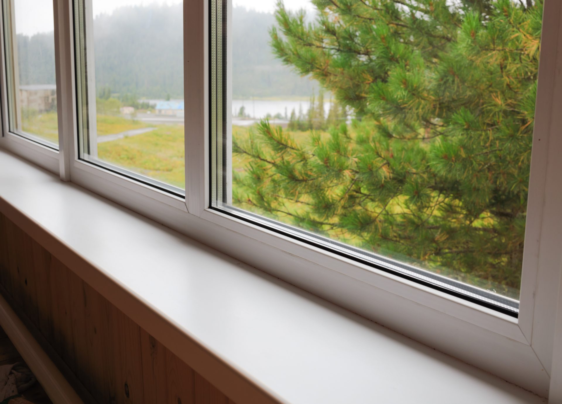 A Canadian-made vinyl picture window looks out over a rugged landscape