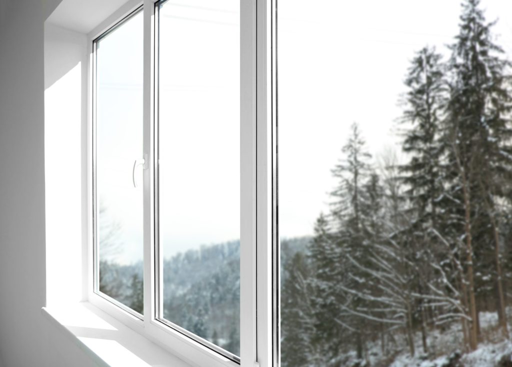Reviews – Windows & Doors – Alberta | GreenFox Windows & Doors Alberta home with GreenFox replacement casement windows and snow outside