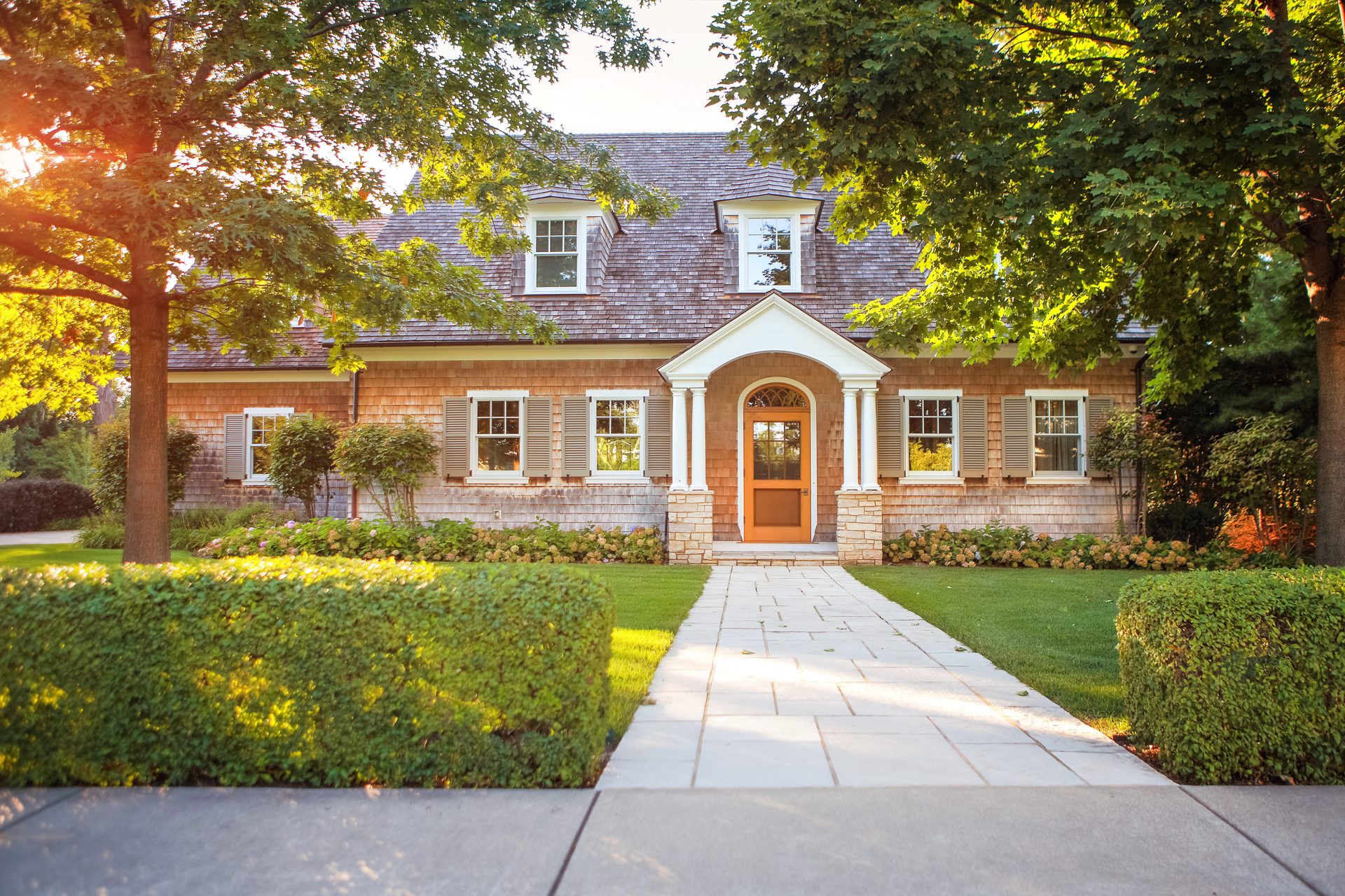 Brick two-story house with a shingle roof
