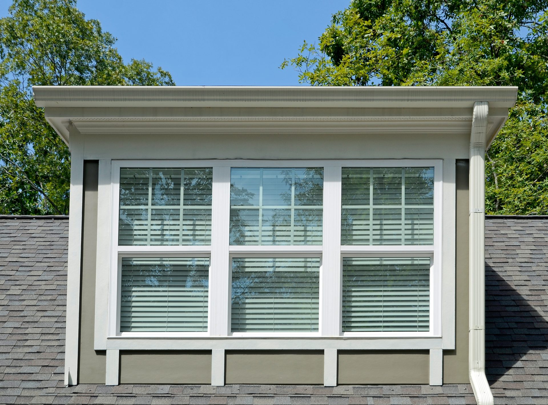 Dormer windows on the second story of a house