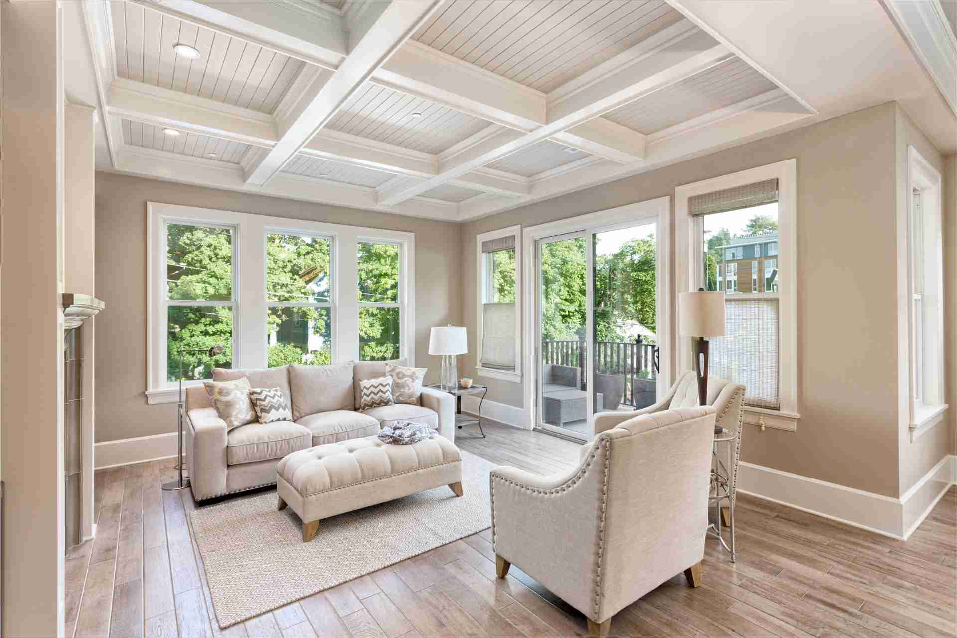 White-framed replacement windows in living room Cochrane home installed by Greenfox Windows & Doors