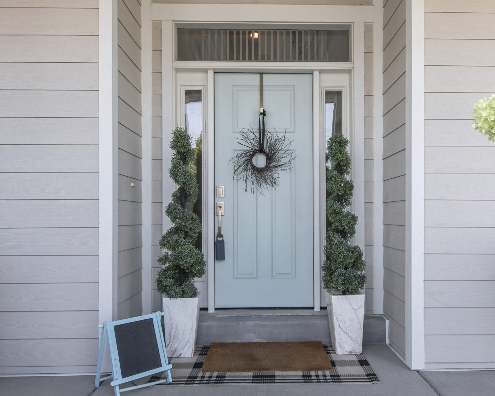 New light blue entry door on Alberta home | GreenFox Windows & Doors