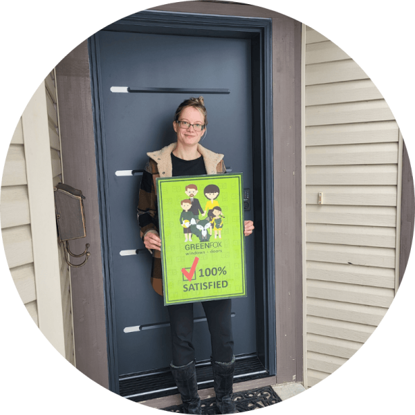 A GreenFox Customer holding a 100% Satisfied Sign