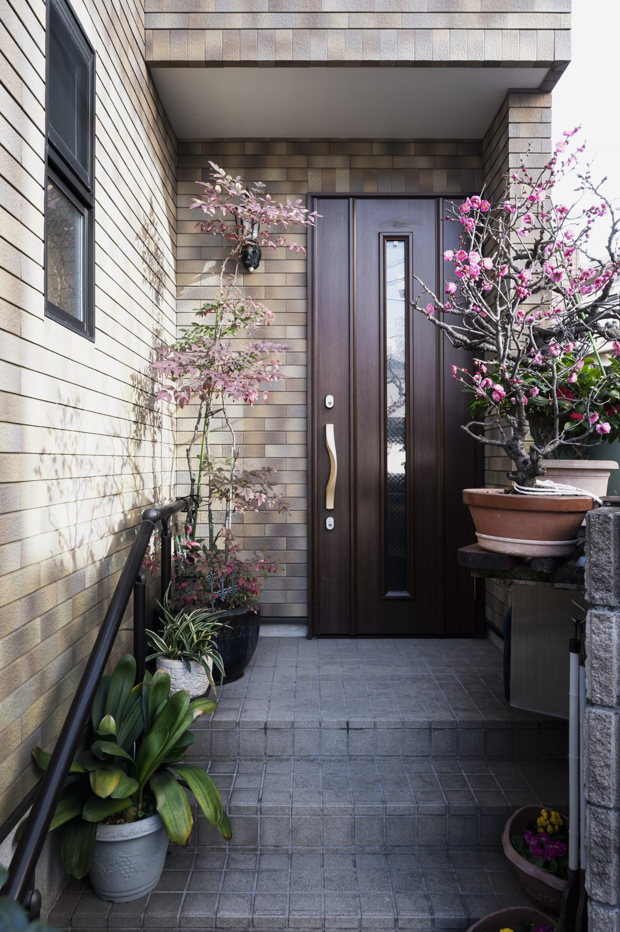 Brown entry door with window and bronze hardware In Medicine Hat, AB | GreenFox Windows & Doors