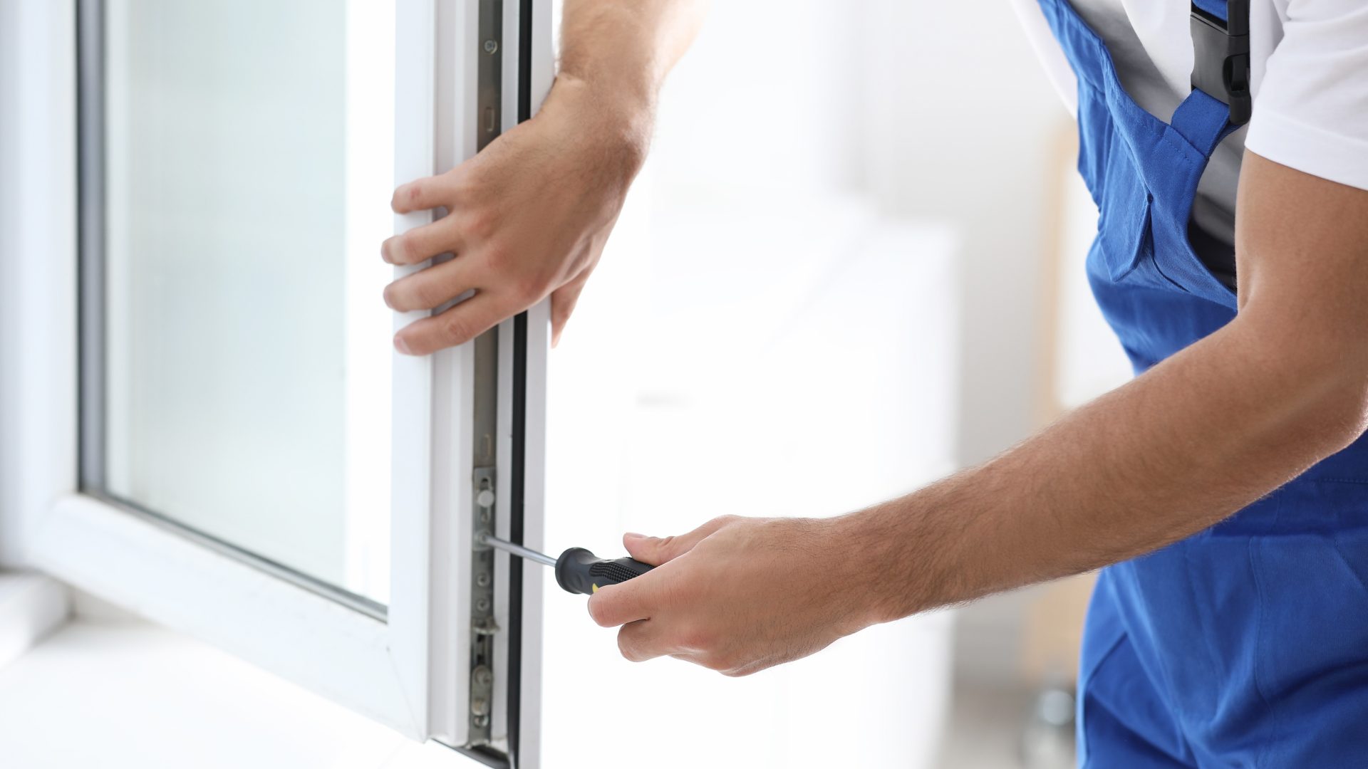 Close view of an installer making adjustments on a new window